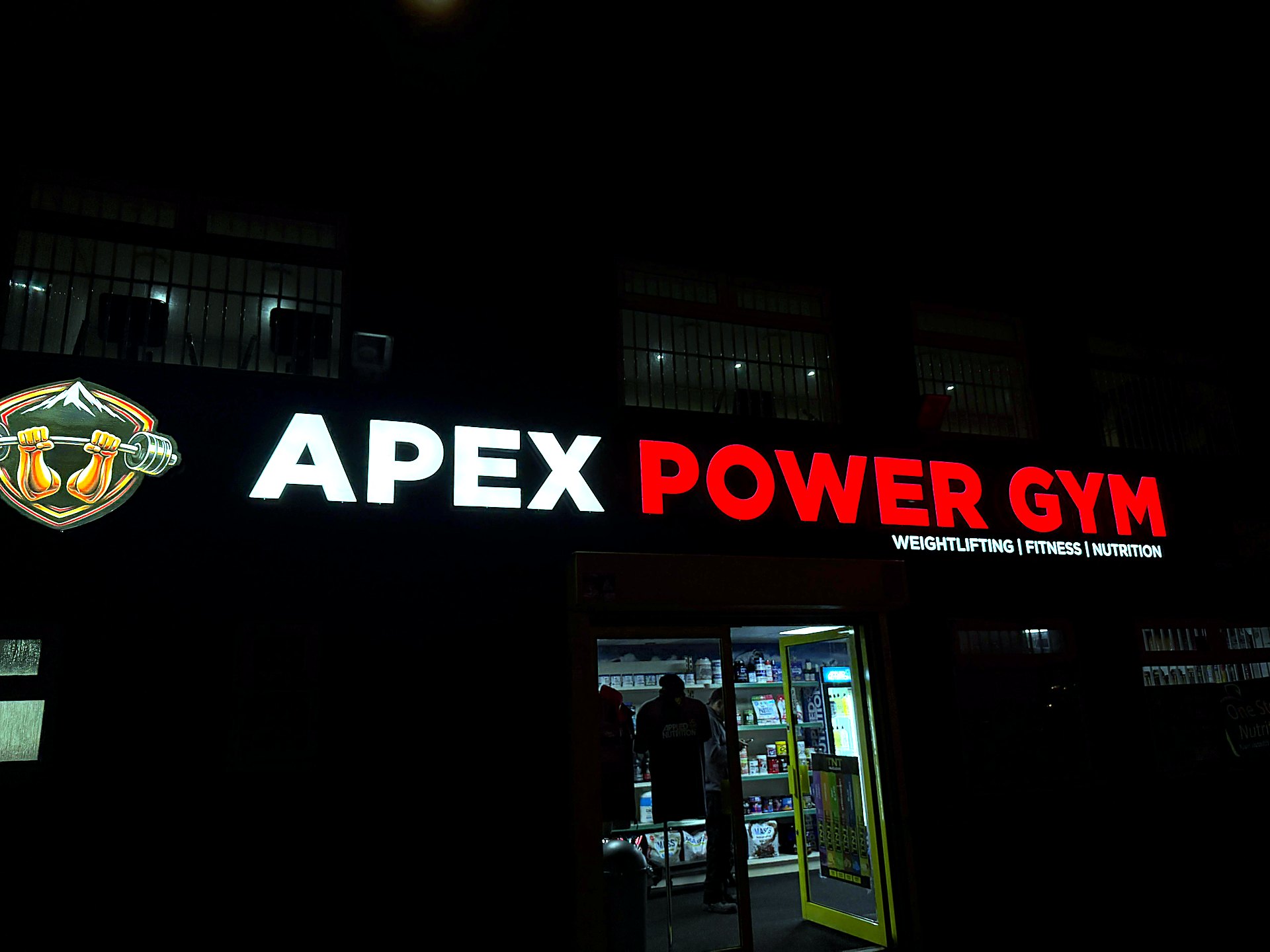 Apex Power Gym LED sign at night