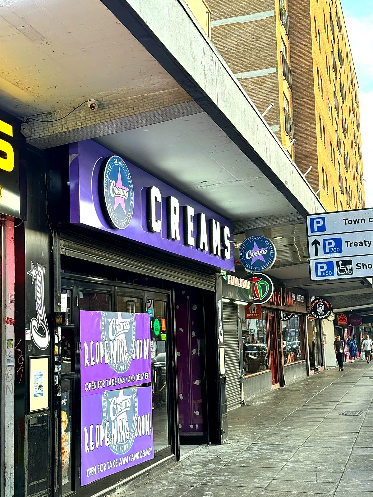 Creams illuminated shop front