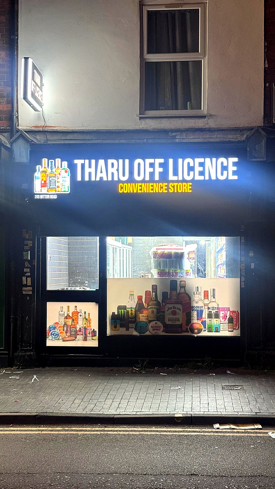 Tharu Off Licence illuminated sign